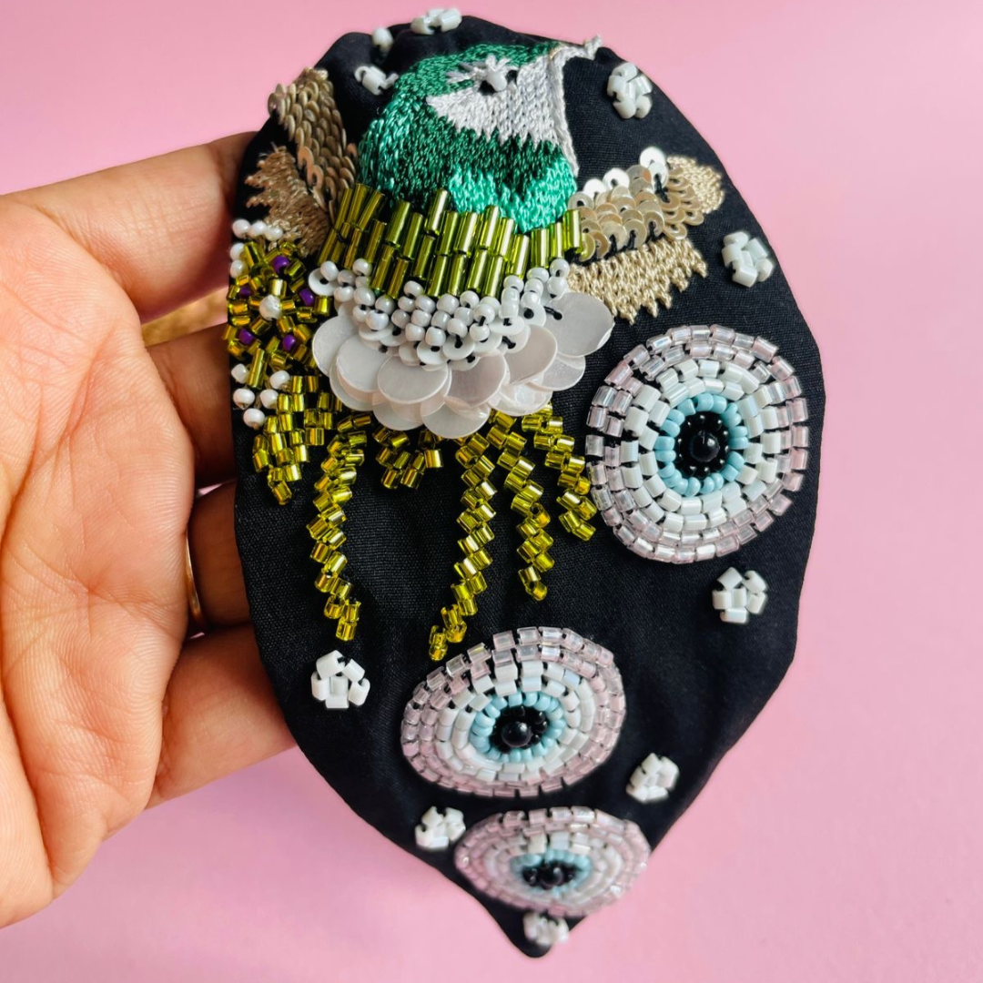 Beaded black bird evil eye headband